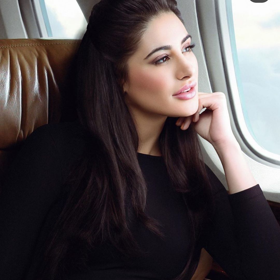 Nargis Fakhri siting in the aeroplane