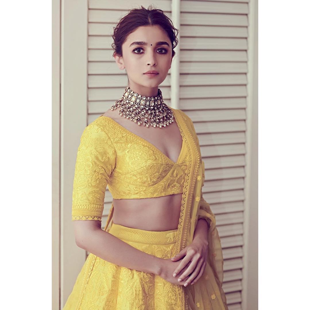 Simple and sober Alia Bhatt in yellow blouse and necklace