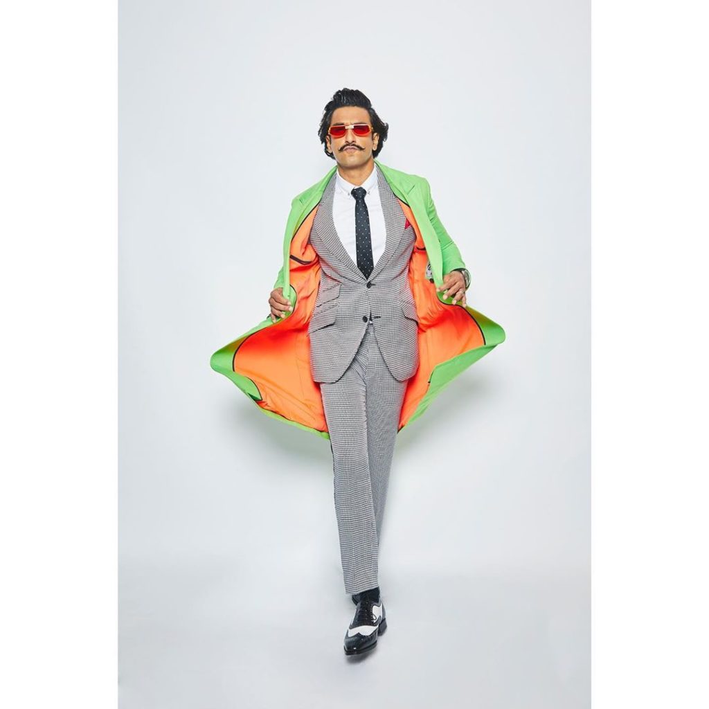 Style Icon bollywood actor Ranbeer Singh in green and orange coat