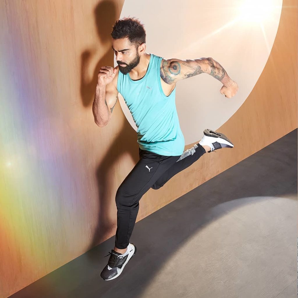 Virat kohli doing brand promotion of Puma India with Tattoo on his left arm and hand