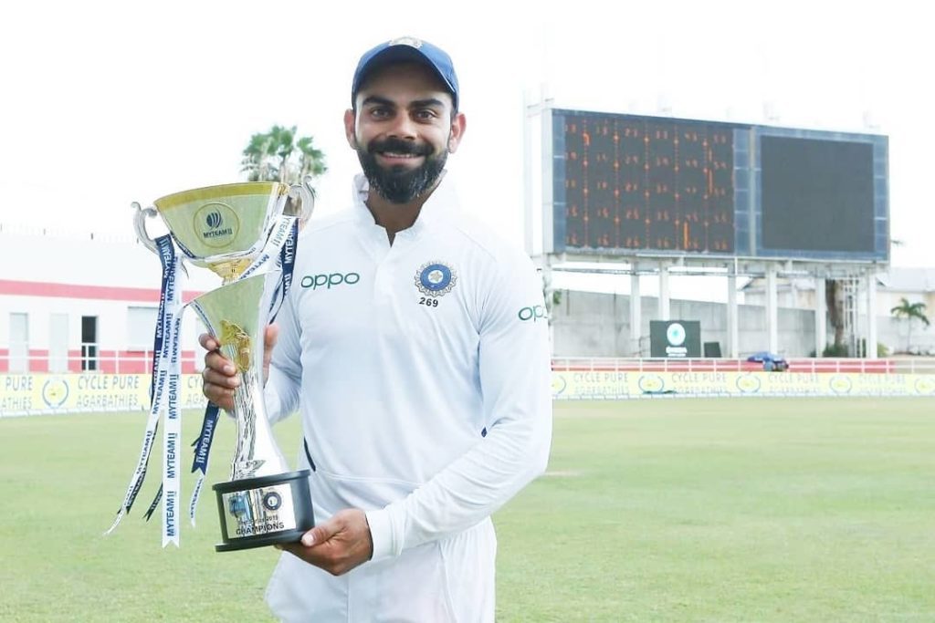Virat kohli with champion cricket test series trophy