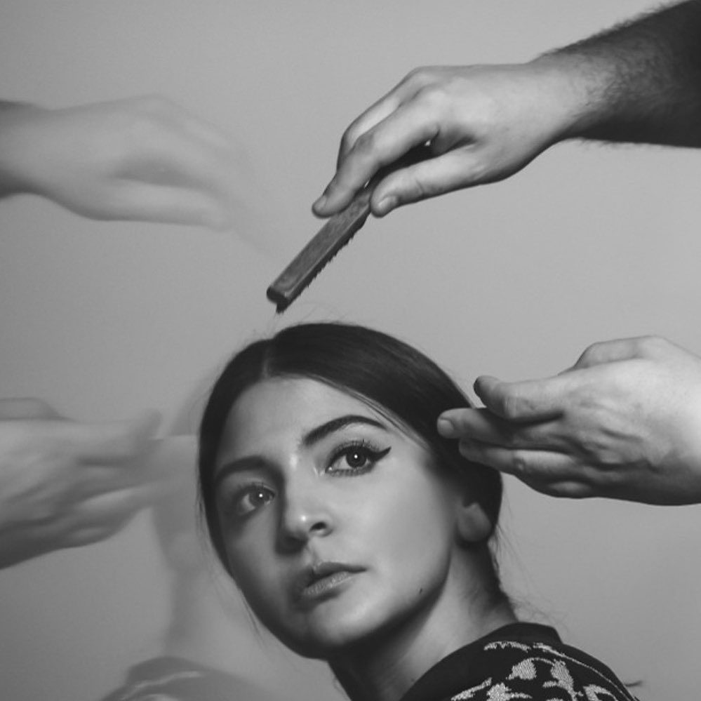 artistic photo of actress anushka sharma during makeup