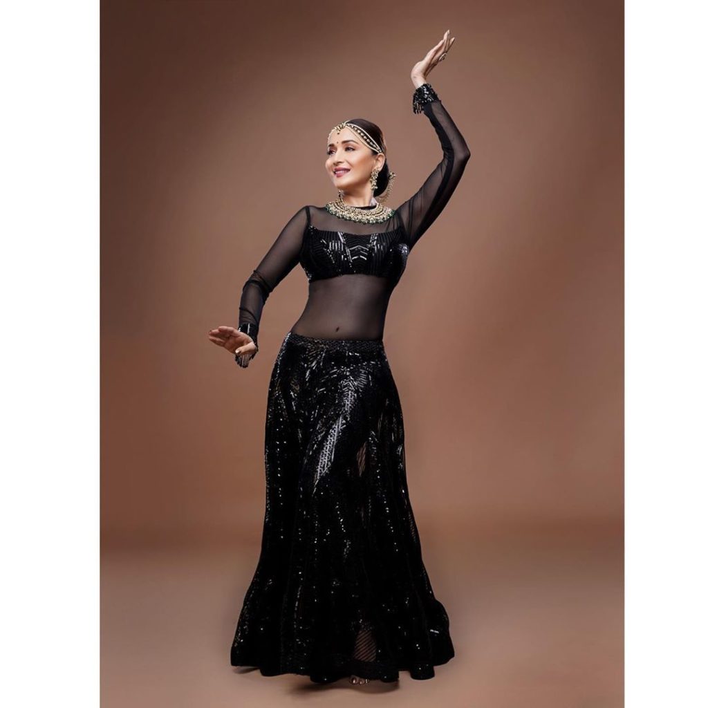 Madhuri Dixit giving a ancing pose with black ethnic dress