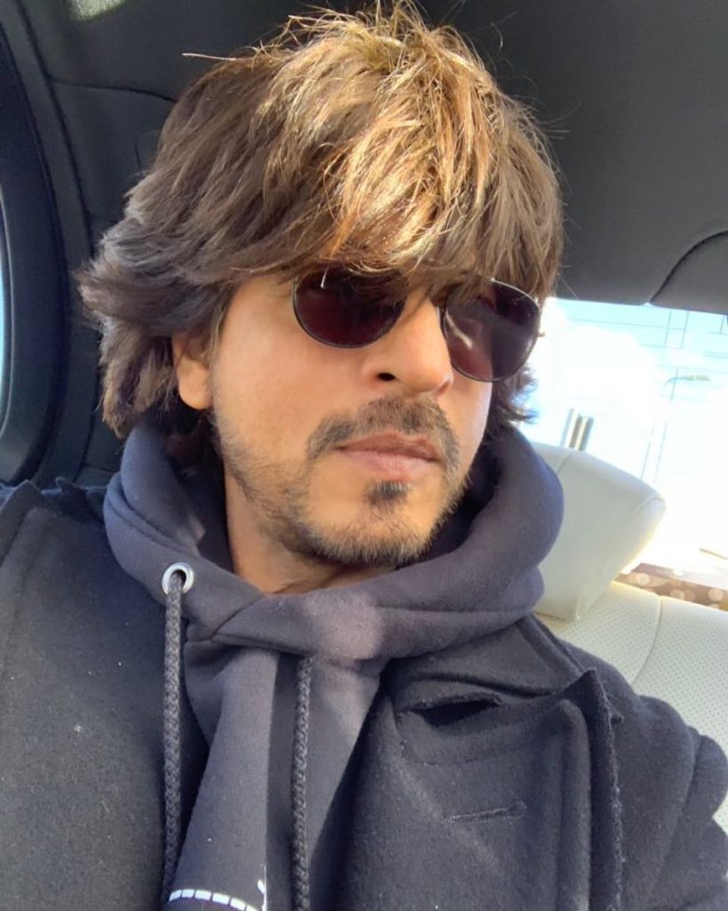 bollywood king shah rukh khan asking his fans whether he should keep growing his hairs for few more months