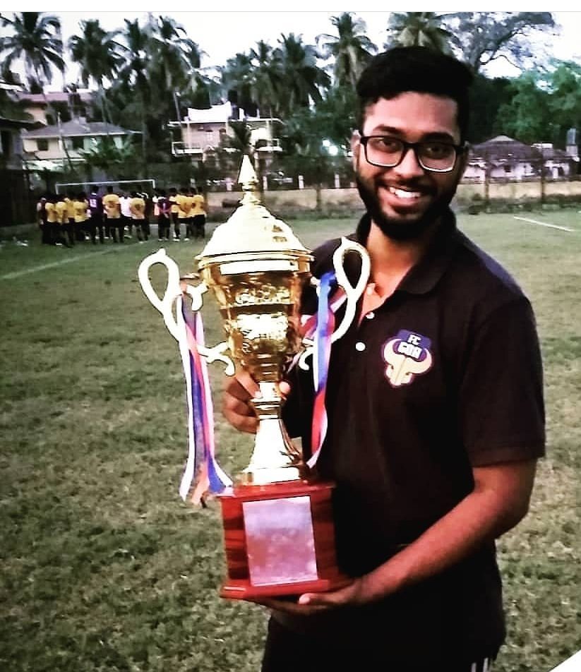 abishek colaco with a trophy